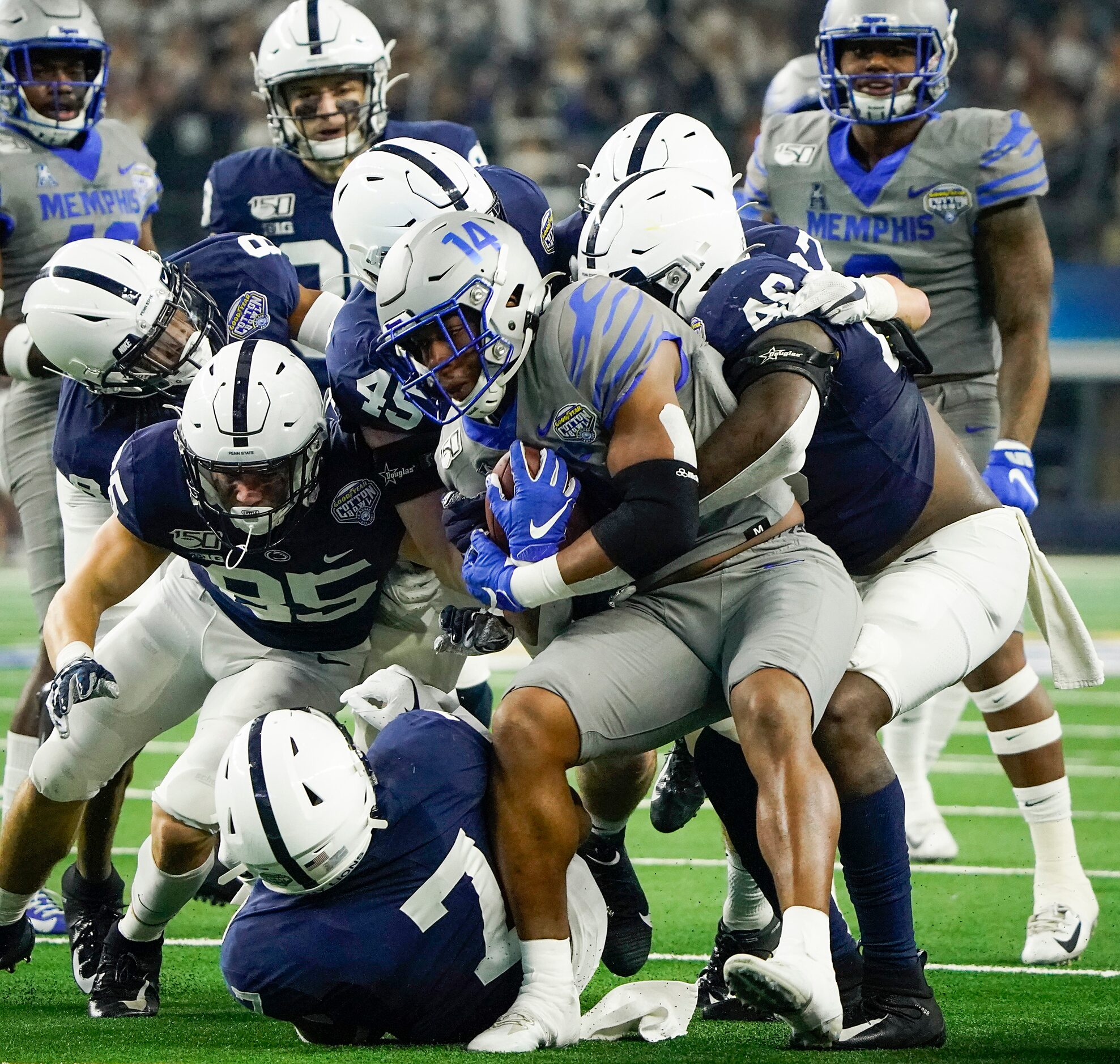 Memphis wide receiver Antonio Gibson (14) is brought down by the Penn State defenses during...