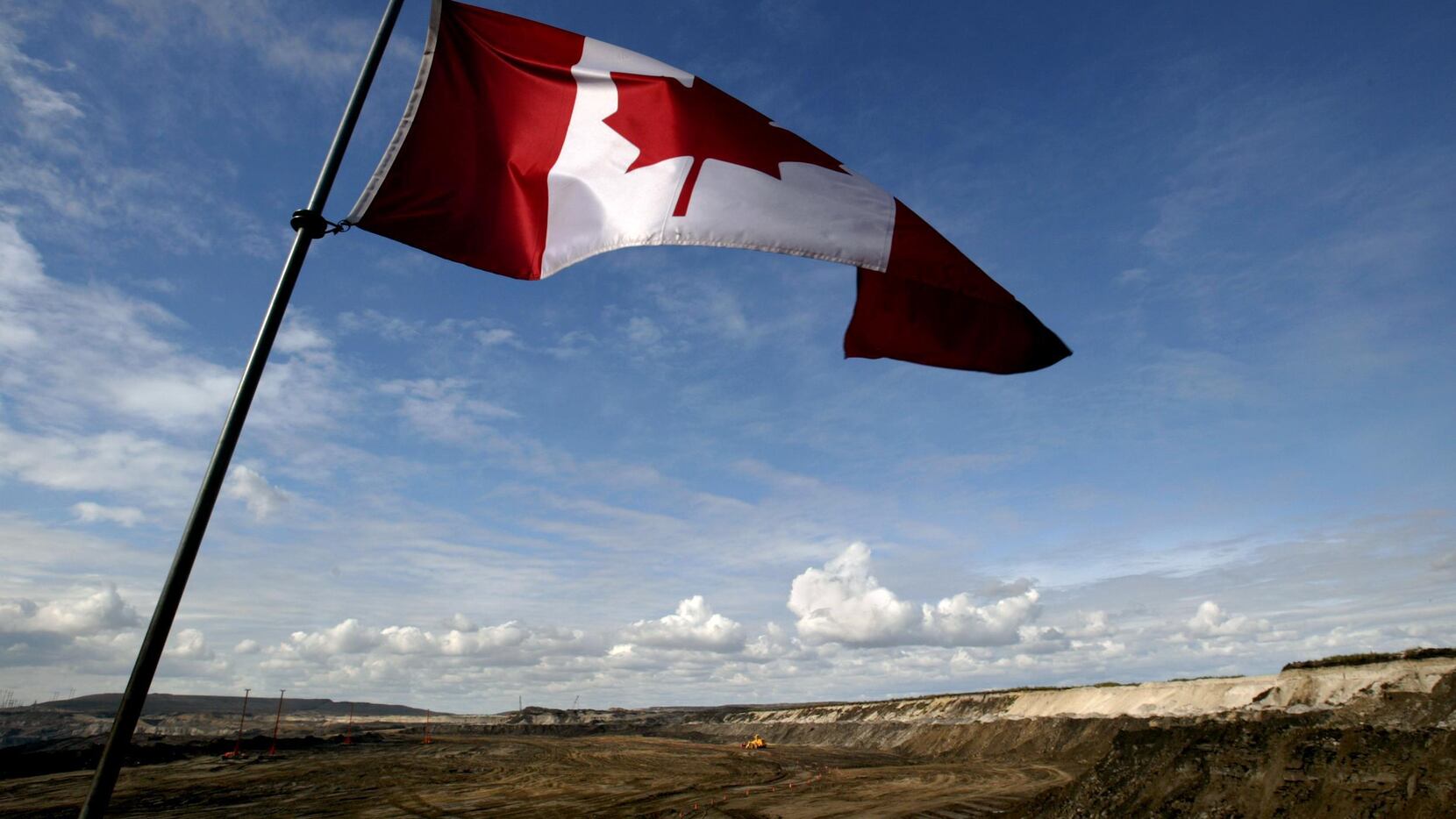 A Canadian flag waves over Alberta.