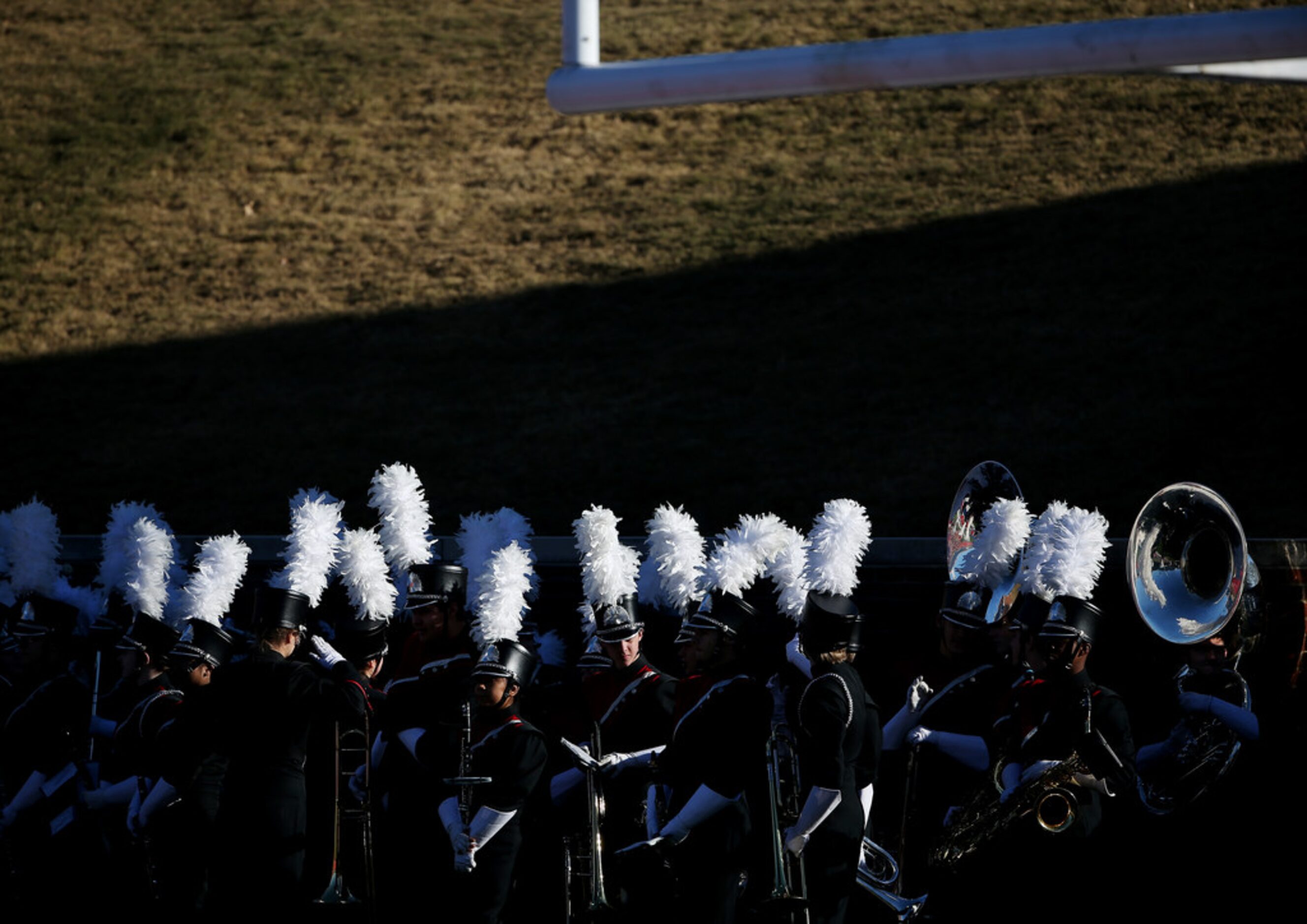 The Mansfield Legacy marching band prepares to play during halftime of the Class 5A Division...