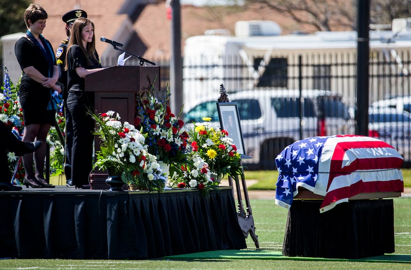  Marta Danylyk speaks about her fiancÃ©, Euless police officer David Hofer.. At left is...