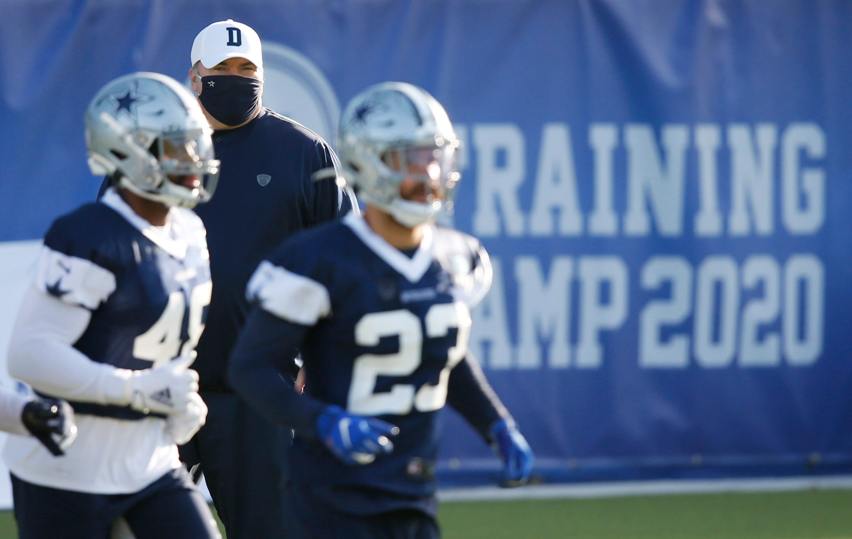 Dallas Cowboys head coach Mike McCarthy watches the team practice during the first day of...