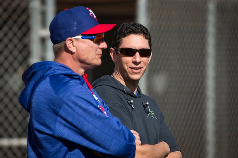 Texas Rangers General Manager Jon Daniels (right) and manager Jeff Banister watch pitchers...