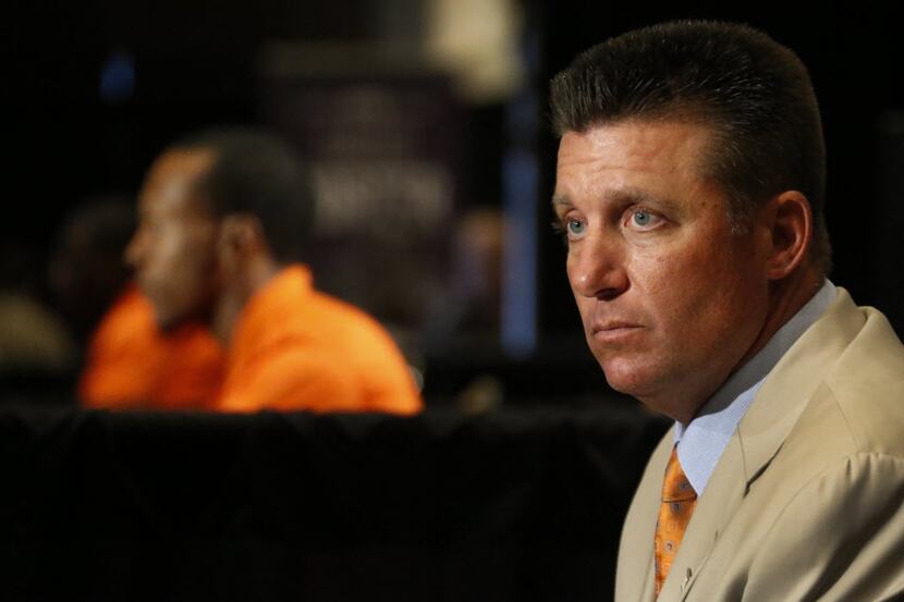 Oklahoma State head coach Mike Gundy listens to questions from the media during the Big 12...