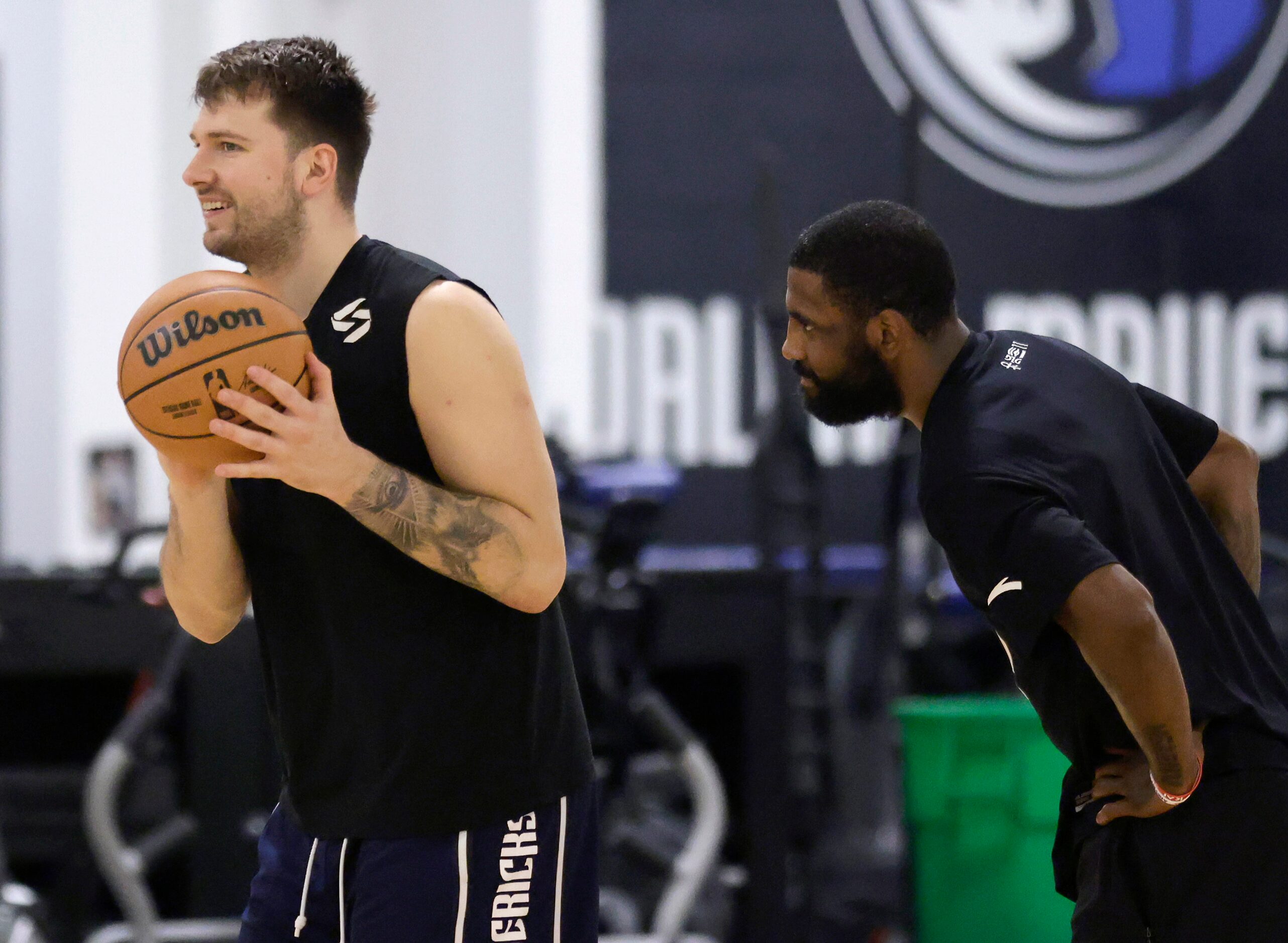 Dallas Mavericks guards Luka Doncic (left) and Kyrie Irving  traded shooting 3-pinters...