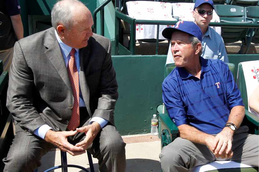 Texas president Nolan Ryan visits with former President George W. Bush before the Texas...