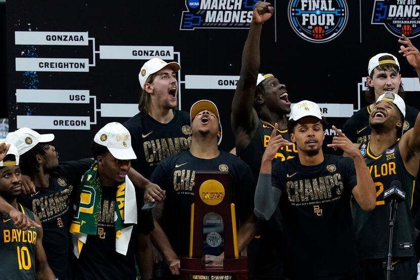 Baylor players celebrate with the trophy after the championship game against Gonzaga in the...