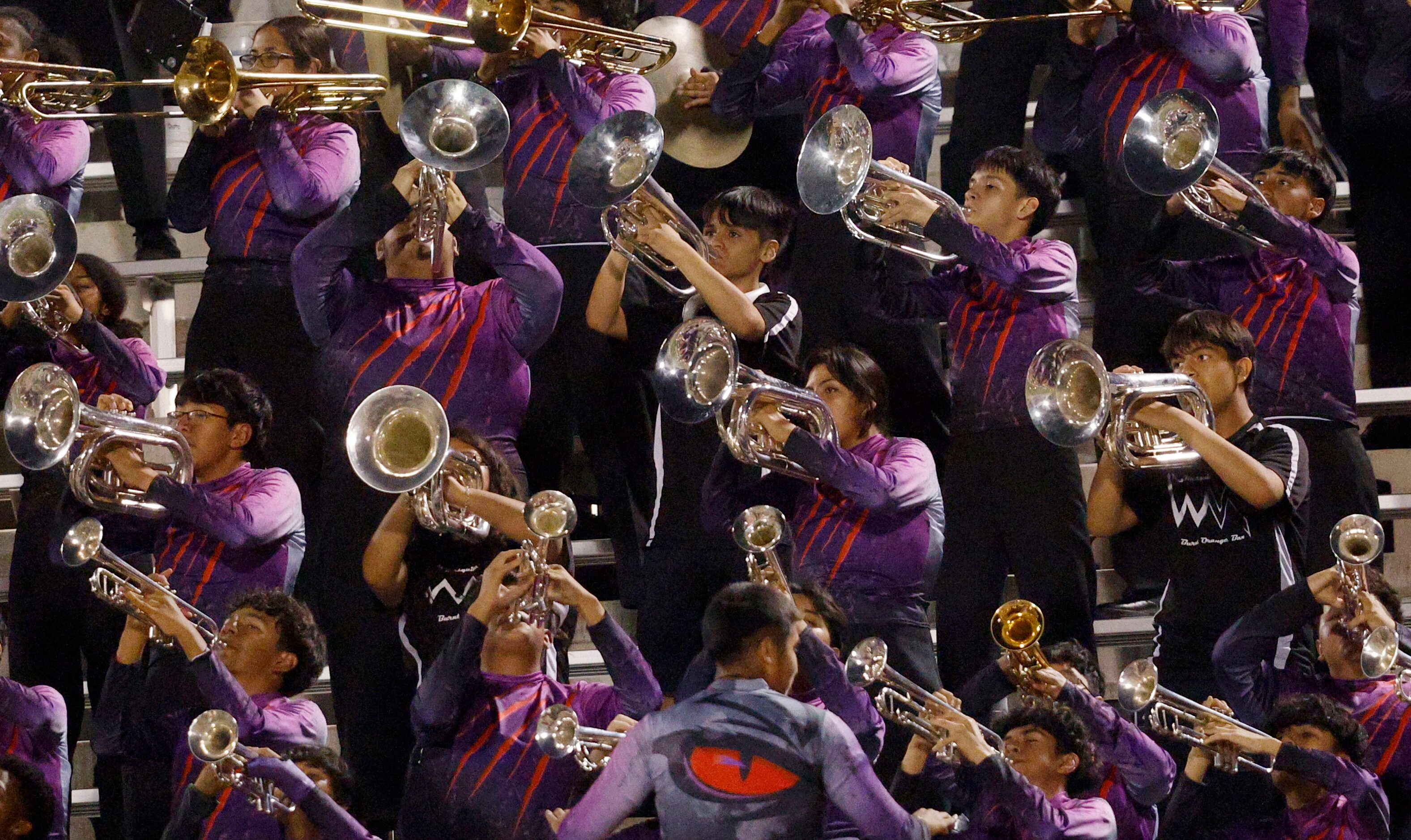 West Mesquite marching band perform during a high school football game against Newman Smith...