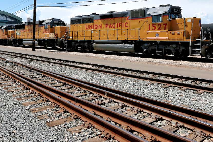 FILE - In this July 15, 2013, file photo, Union Pacific Railroad locomotives sit on a track...