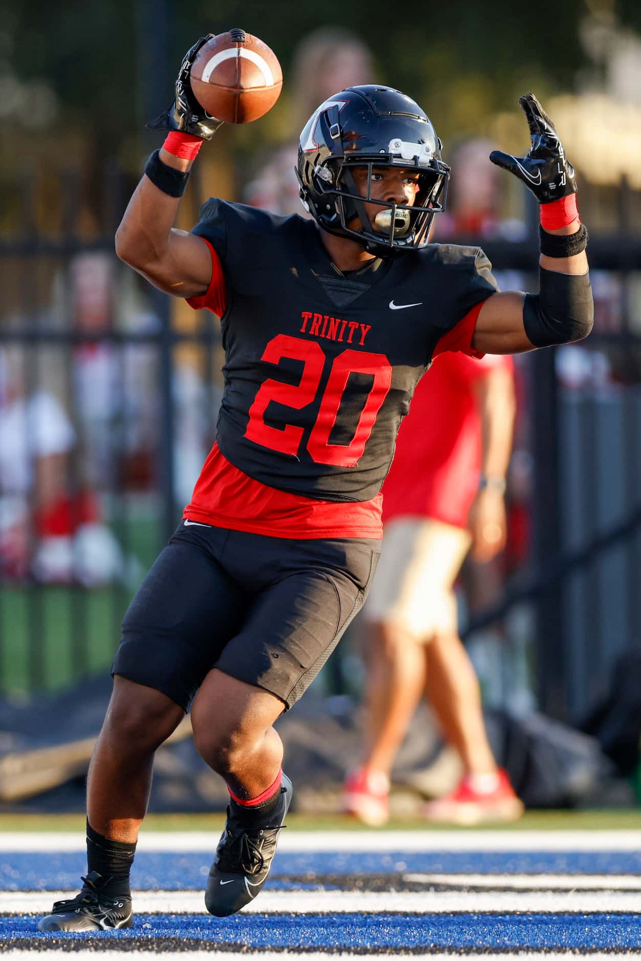 Euless Trinity running back Josh Bell (20) celebrates a touchdown during the first half of a...