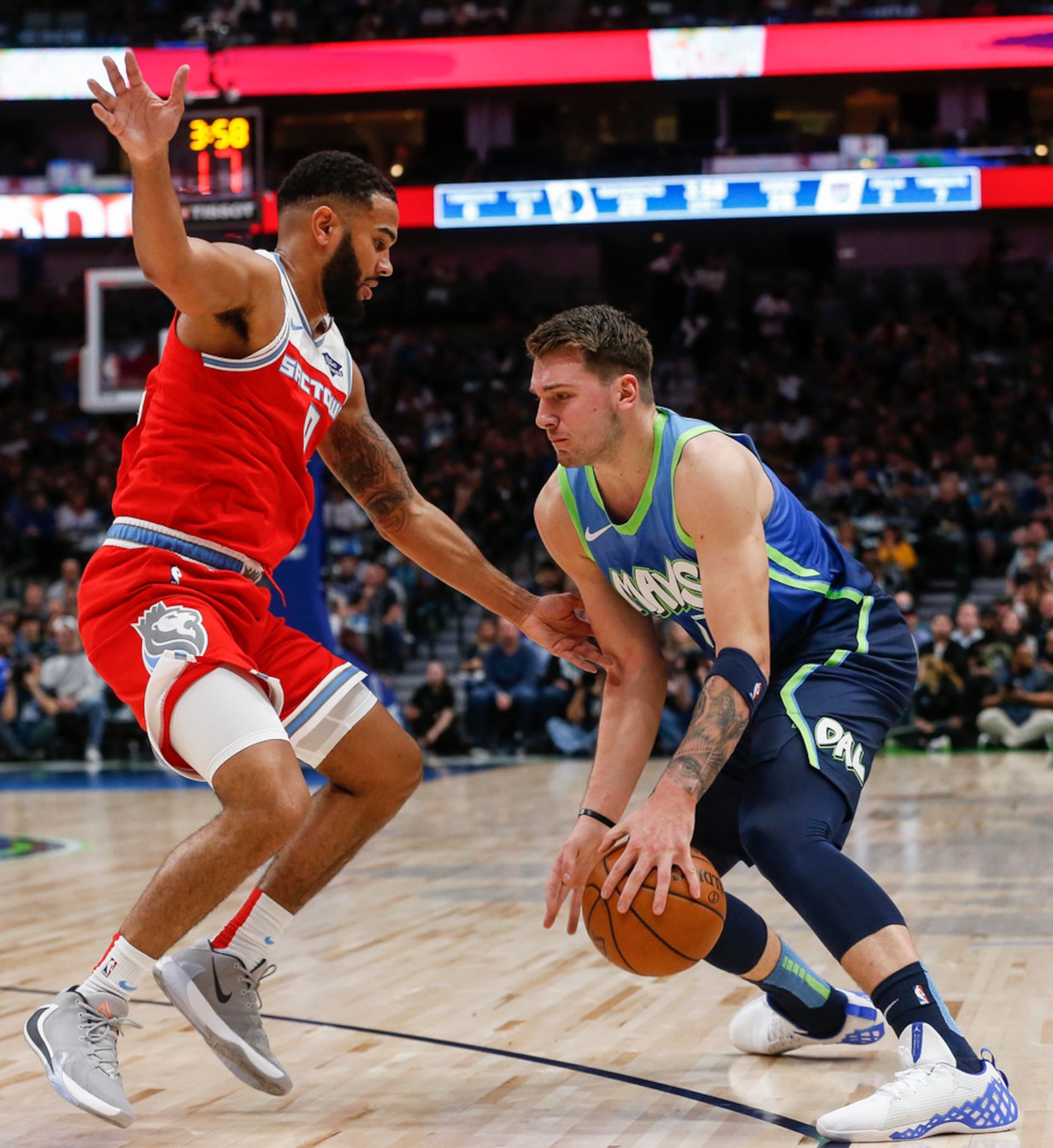 Dallas Mavericks forward Luka Doncic (77) drives past Sacramento Kings guard Cory Joseph (9)...