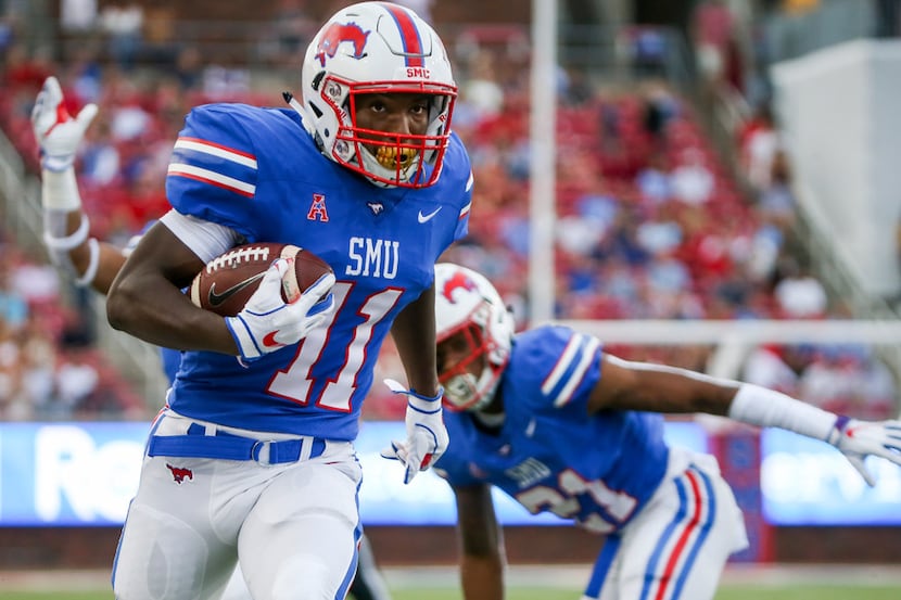 Southern Methodist Mustangs wide receiver Jared Miles (11) scores a touchdown during the...