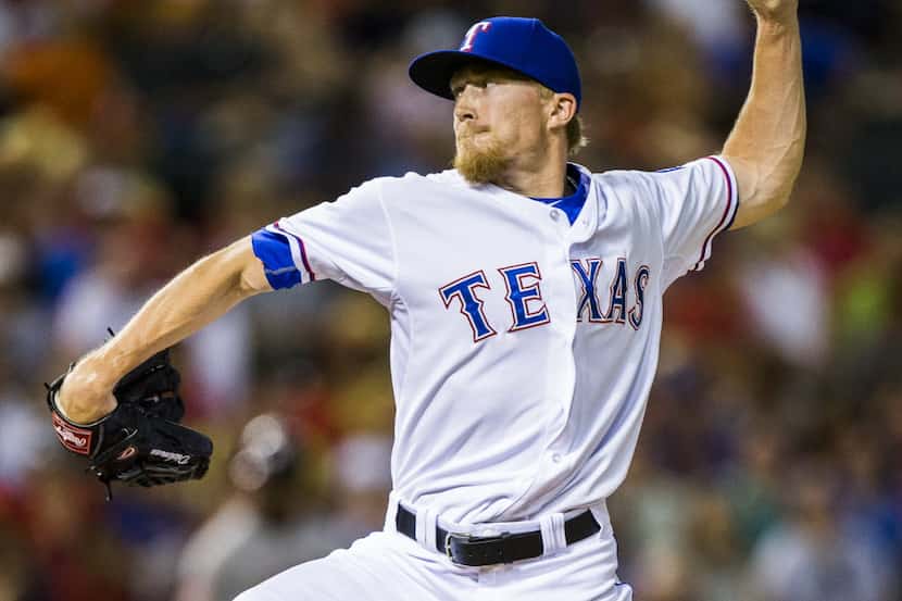 Texas Rangers relief pitcher Jake Diekman (41) pitches during the eighth inning of their...