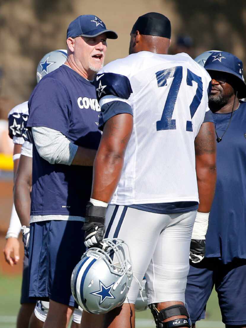 Dallas Cowboys offensive line coach Frank Pollack talks with Dallas Cowboys tackle Tyron...