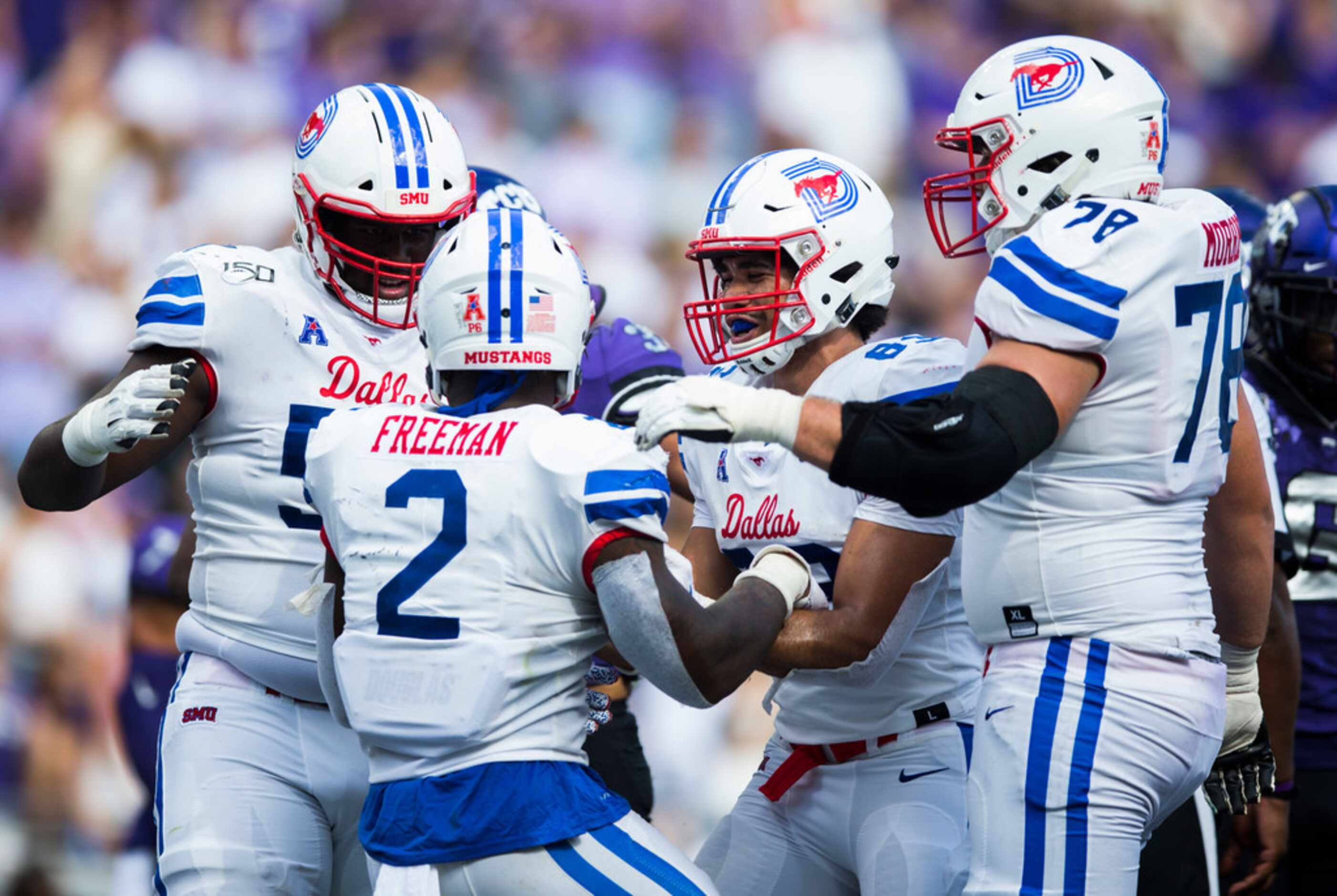 Southern Methodist Mustangs players celebrate a touchdown by Southern Methodist Mustangs...