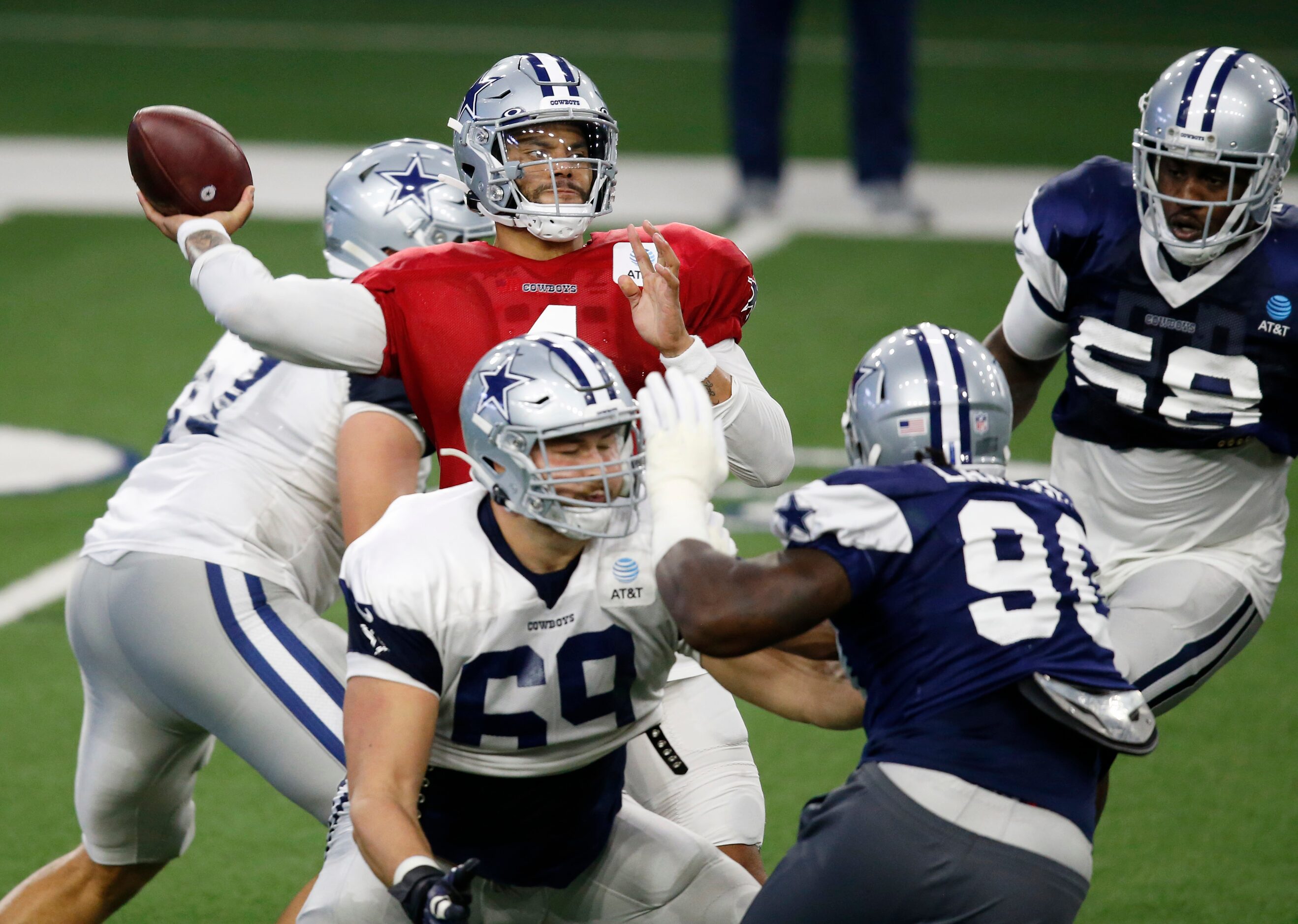 Dallas Cowboys quarterback Dak Prescott (4) attempts a pass in practice during training camp...