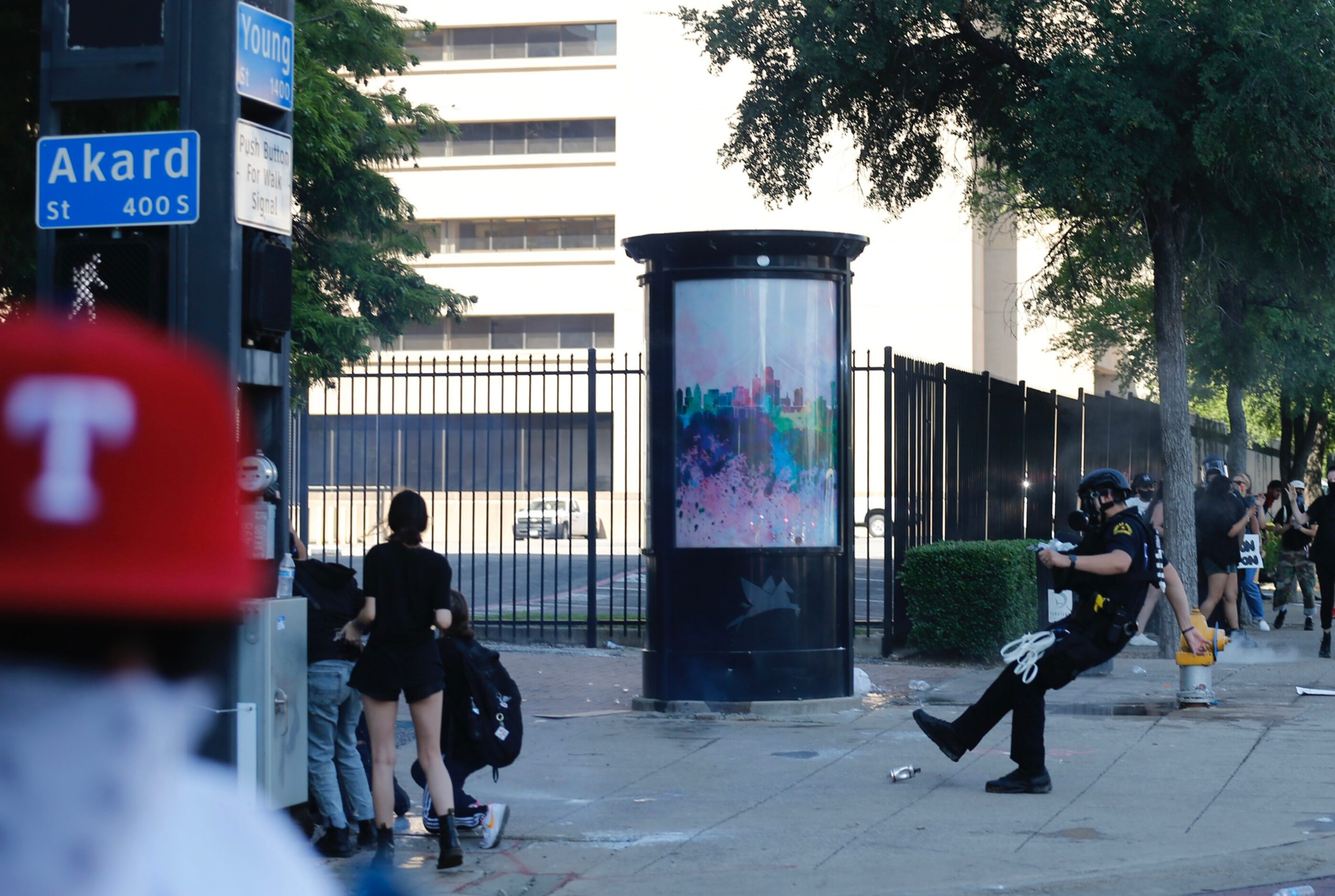 Dallas Police work on clearing an area at the intersection of Young and Akard during a...