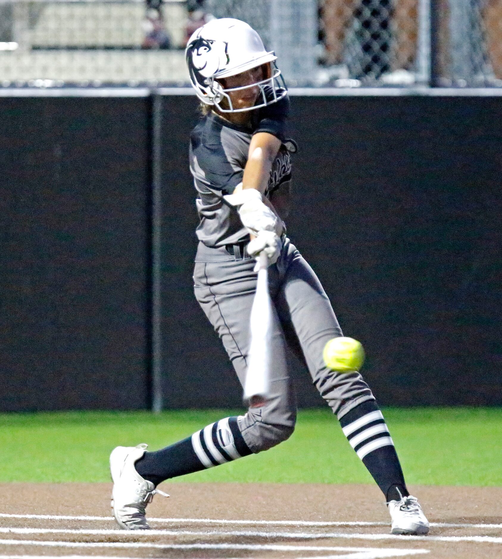 Denton Guyer High School shortstop Aubriella Martinez (12) makes contact in the third inning...