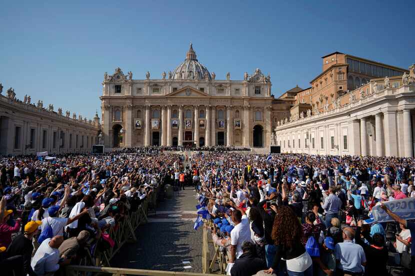 Faithful fill St. Peter's Square during a canonization ceremony, at the Vatican, Sunday,...