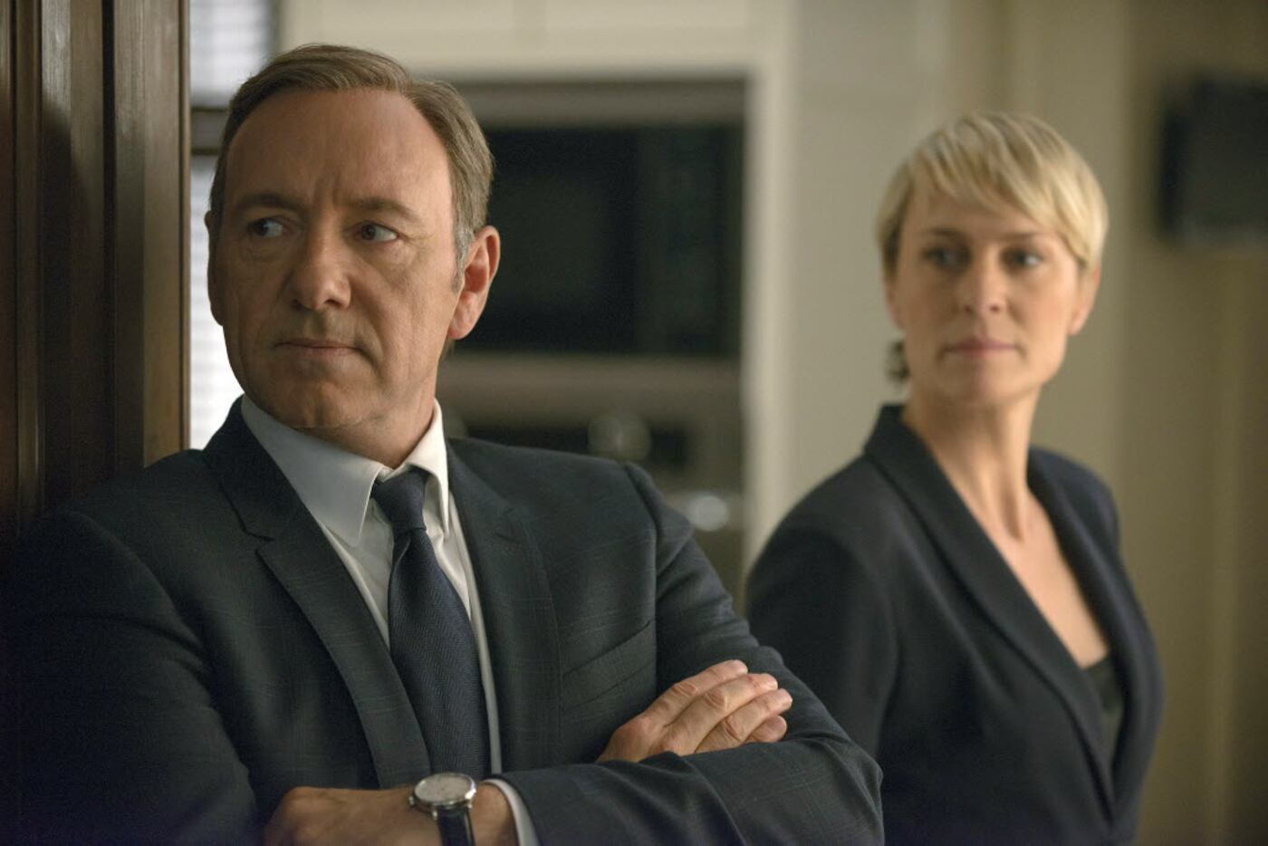 This image released by Netflix shows Kevin Spacey as Francis Underwood, left, and Robin...