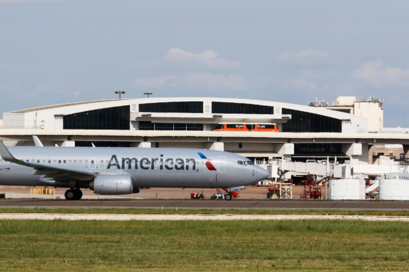 American Airlines plane moves on the tarmac at DFW International Airport on Wednesday,...