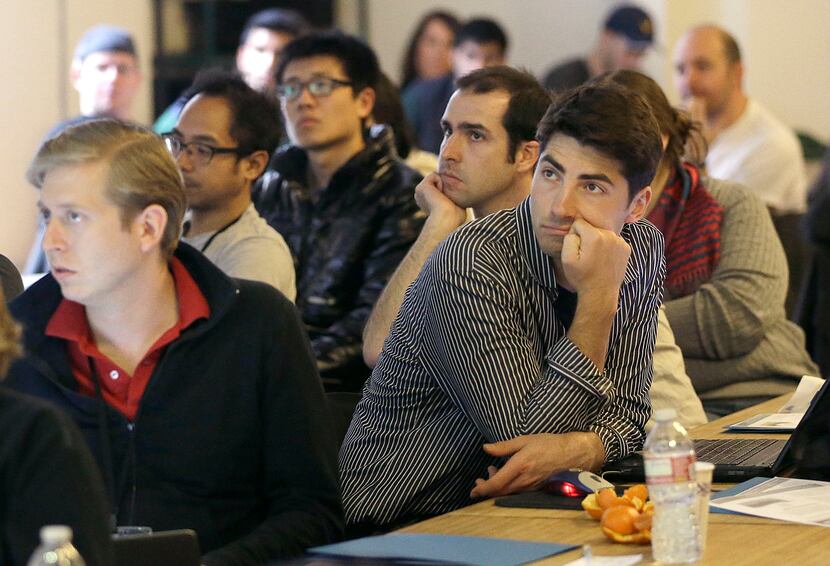 In this Saturday, Feb. 8, 2014 photo, Segah Meer, right, and other participants listen to...