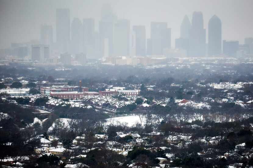 The downtown Dallas skyline was obscured as snow returned to North Texas on Feb. 27, 2015.