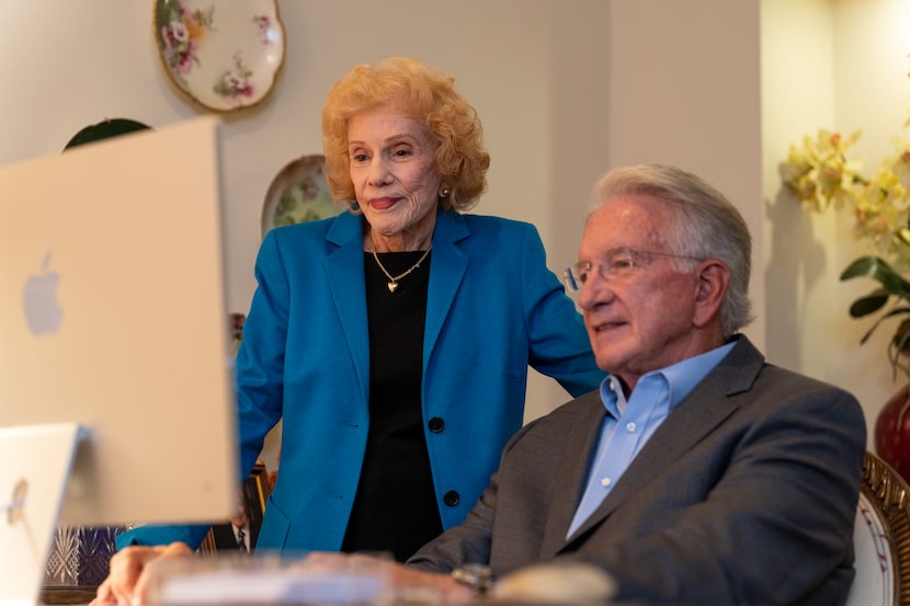 Residents of Edgemere Senior Living sitting at a computer