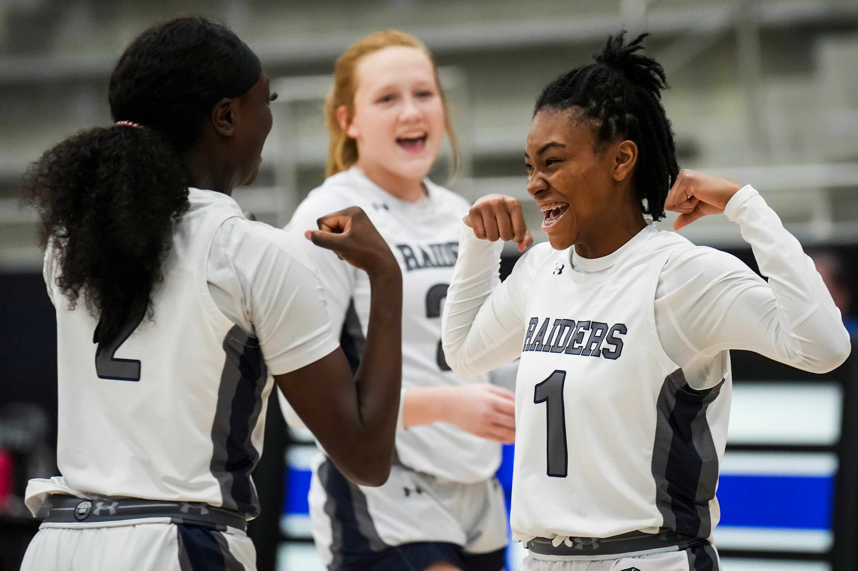 Wylie East's Taylor Dailey (1) laughs with Lizette Landry (2) as she is introduced before a...