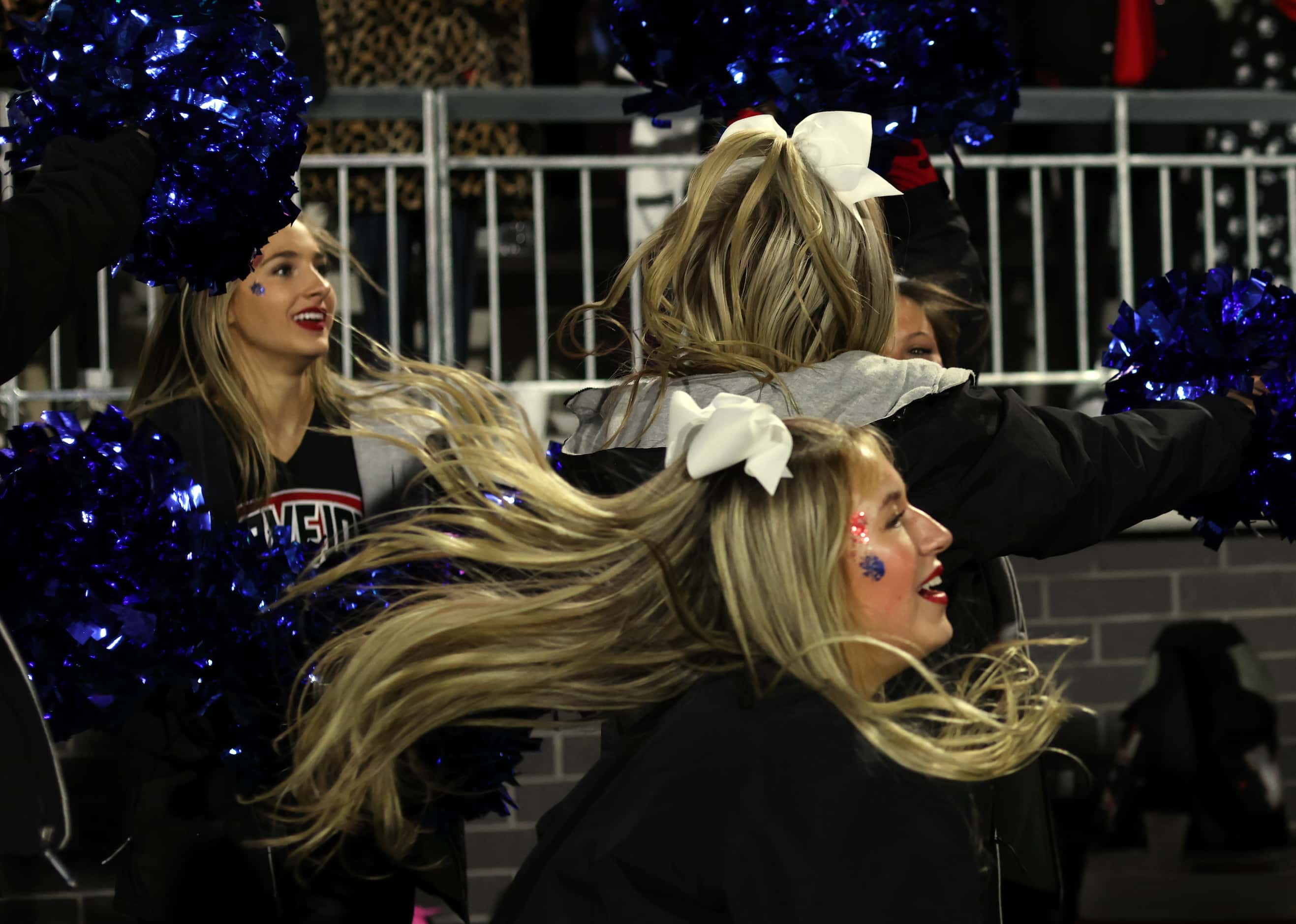 Lucas Lovejoy cheerleaders glance at the scoreboard clock as the final seconds ran down in...
