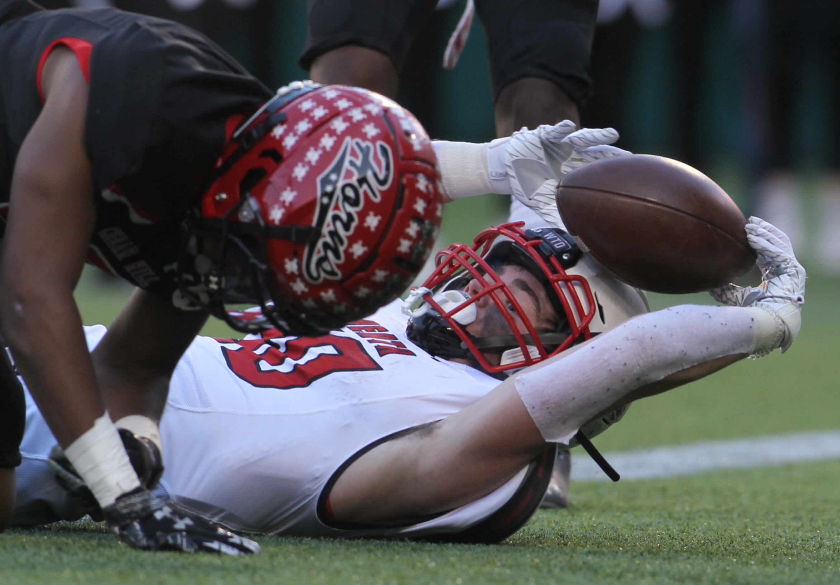 Rockwall Heath running back Preston Landis (30) scores a 2nd quarter rushing touchdown in...