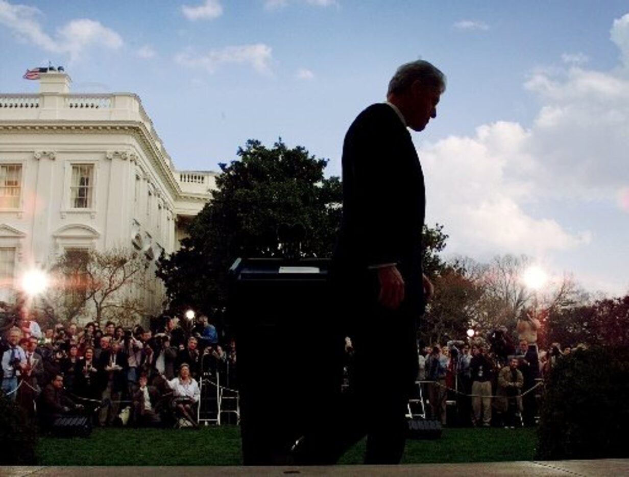 President Bill Clinton walks away from the podium after making a statement in the Rose...