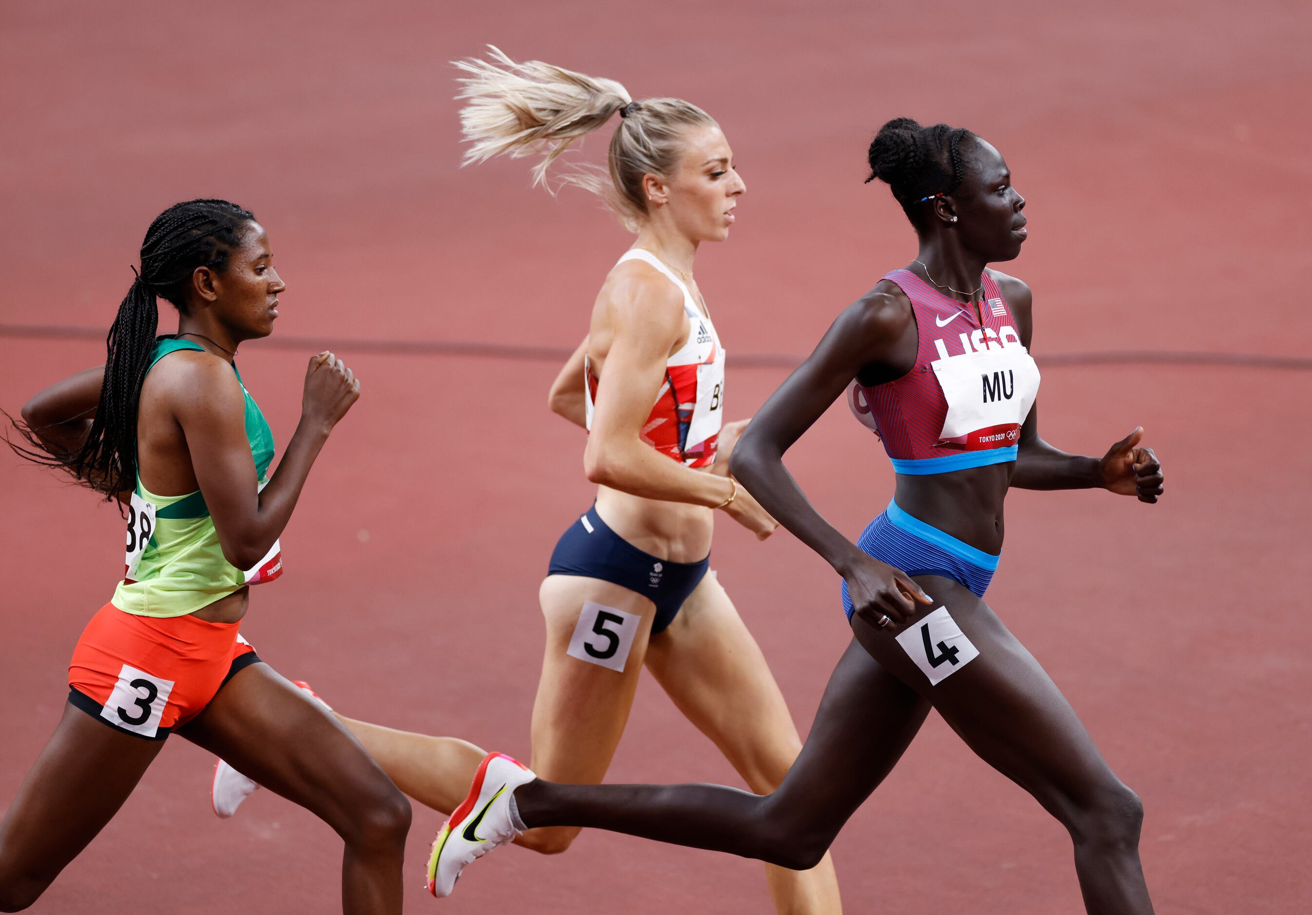 USA’s Athing Mu leads the way as she competes in the women’s 800 meter semifinal race during...