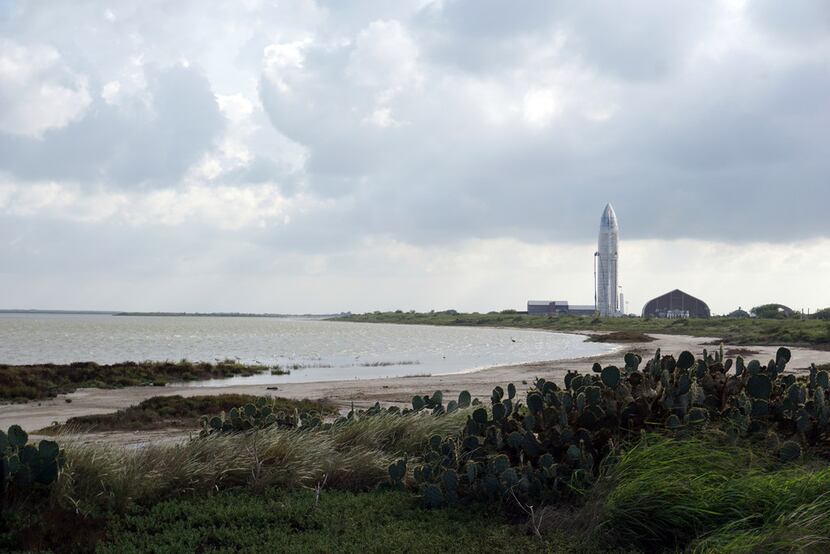 On Sept. 28, 2019 the SpaceX Starship Mk1 is  visible in the distance, surrounded by the...