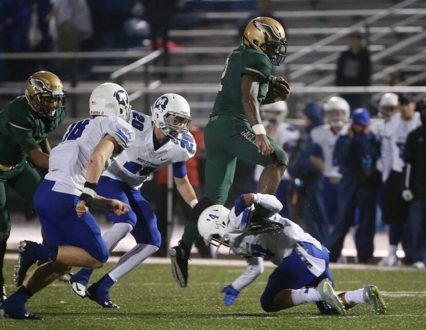 DeSoto running back Keylan Chapman (2) leaps over Midlothian defensive back Cedric Whitaker...