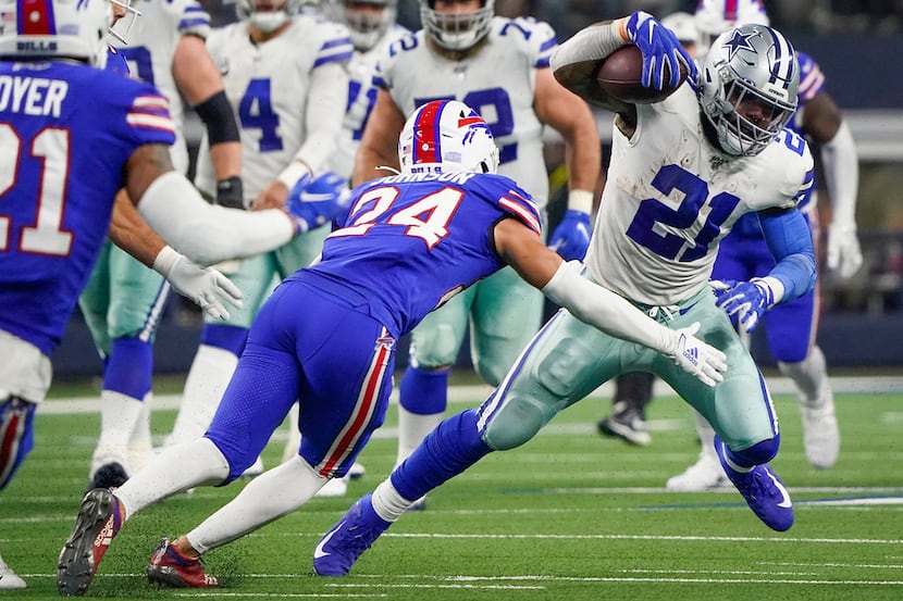 Dallas Cowboys running back Ezekiel Elliott (21) is brought down by Buffalo Bills cornerback...