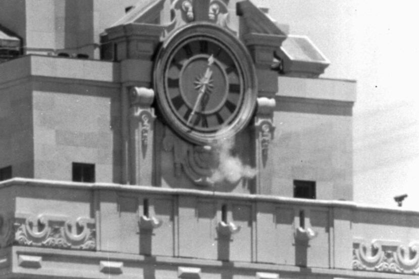 A puff of smoke rises from the University of Texas tower as Charles Whitman fires a shot on...