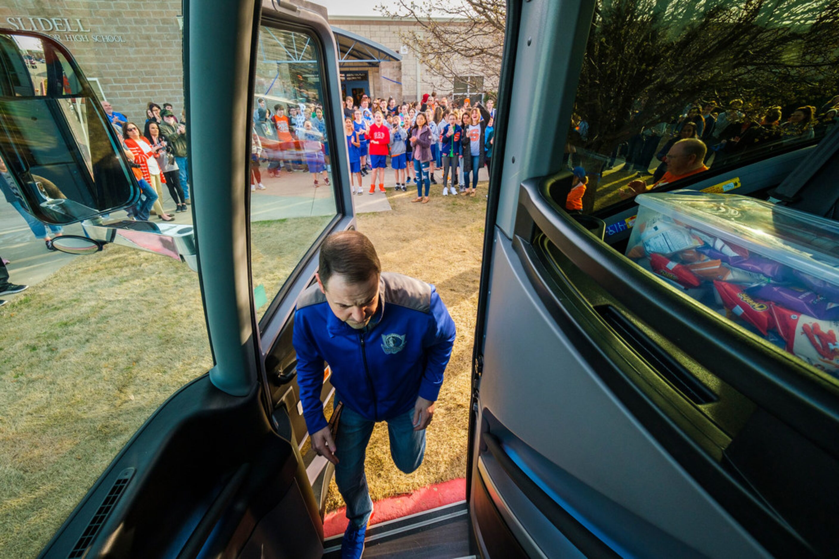 Slidell head coach Casey Pierce boards the bus for the trip to the UIL state basketball...