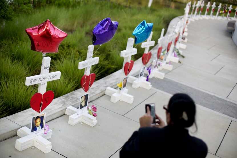 Crosses, one for each victim, line a walkway as a memorial to those killed in the Pulse...