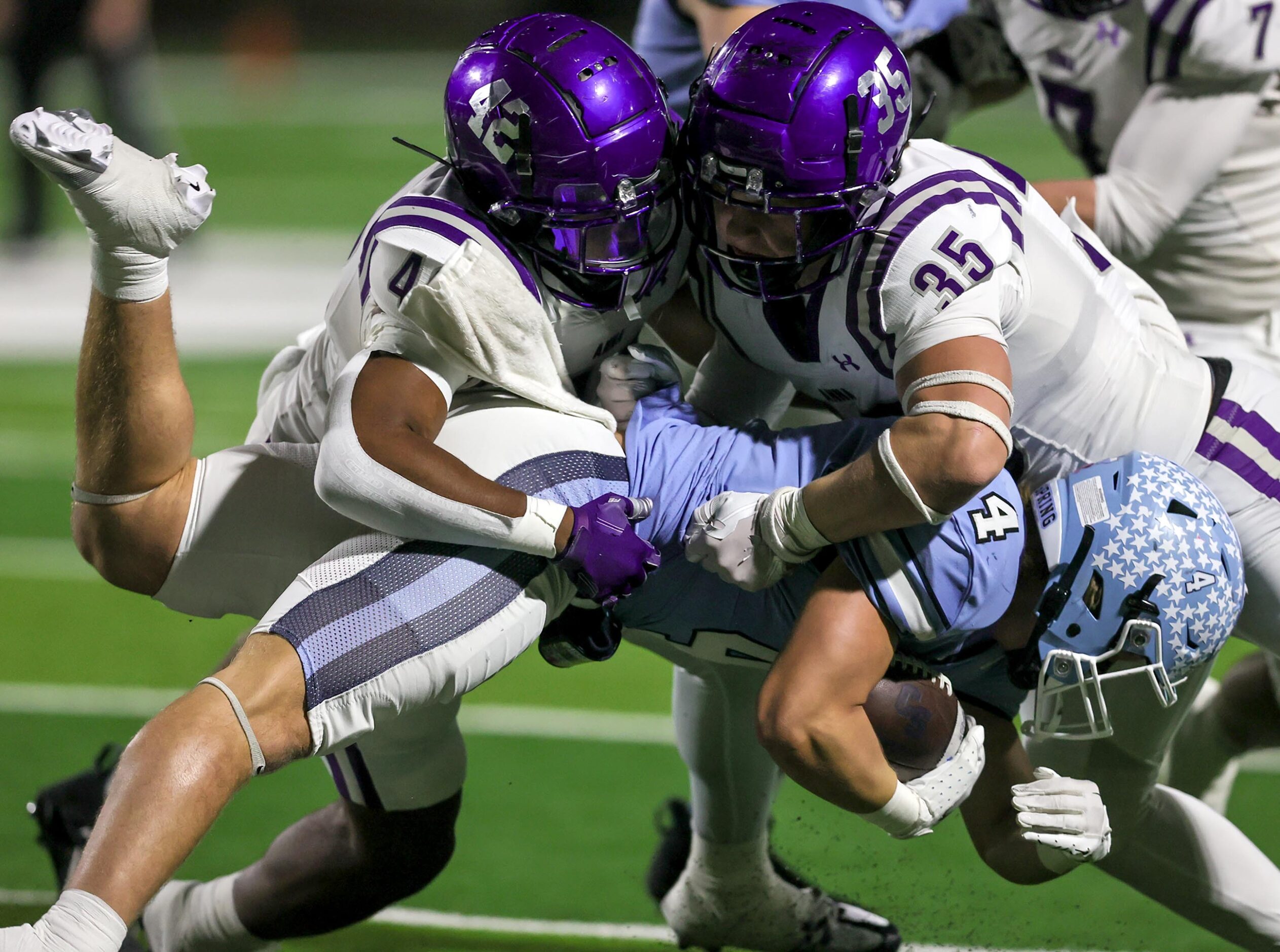 Anna linebacker Abram Greer (42) and linebacker CJ Miller (35) make a stop on China Spring...