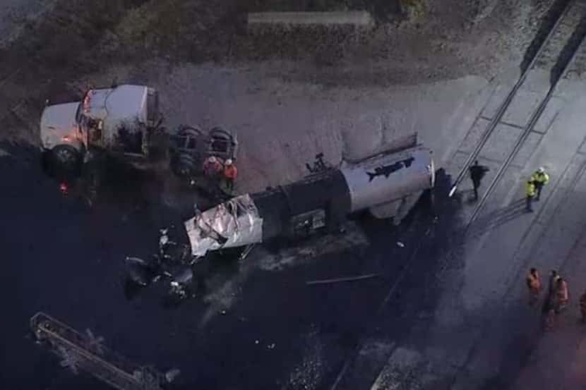 A heavily damaged 18-wheeler leaked fuel after it struck a TRE train Wednesday morning in...