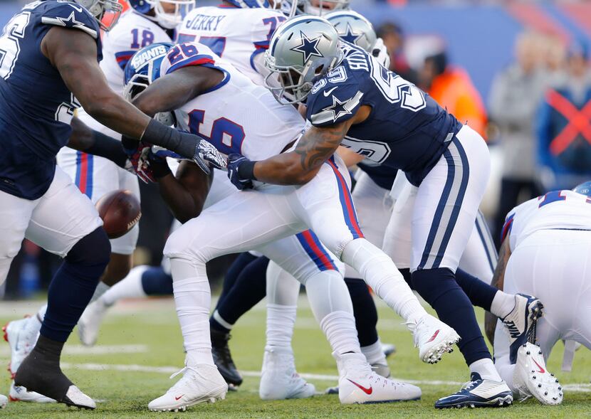 Dallas Cowboys middle linebacker Anthony Hitchens (59) forces New York Giants running back...