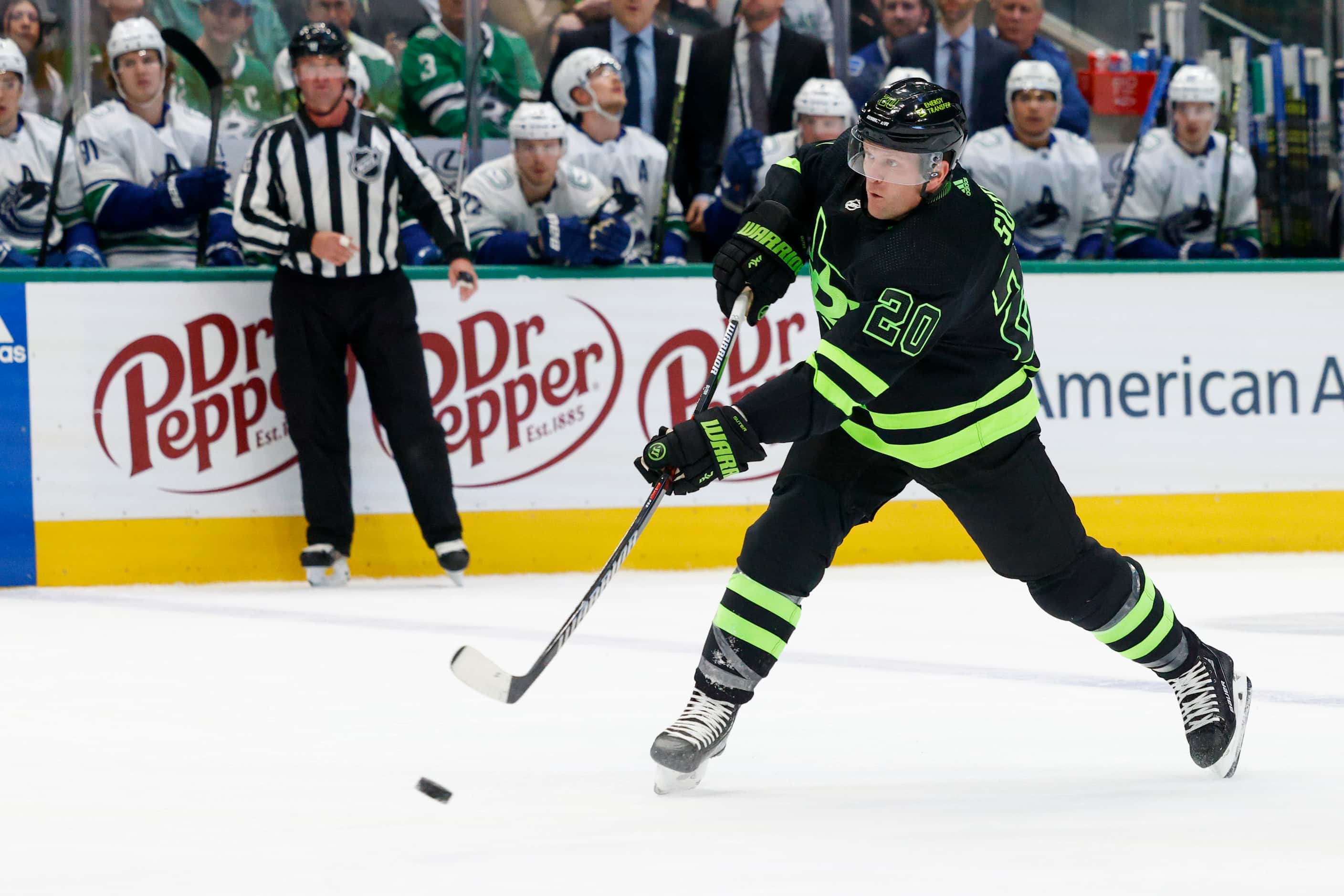 Dallas Stars defenseman Ryan Suter (20) takes a shot towards goal during the first period of...