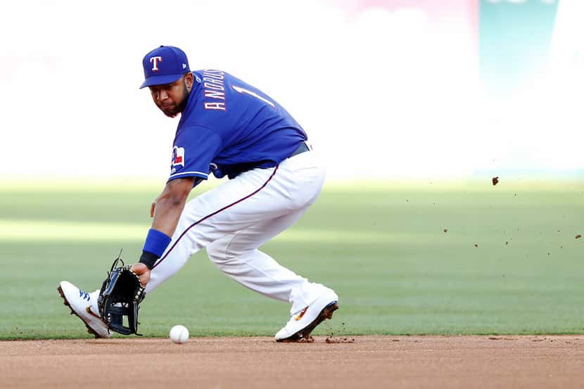 Texas Rangers shortstop Elvis Andrus (1) fields a ball hit by Los Angeles Angels first...