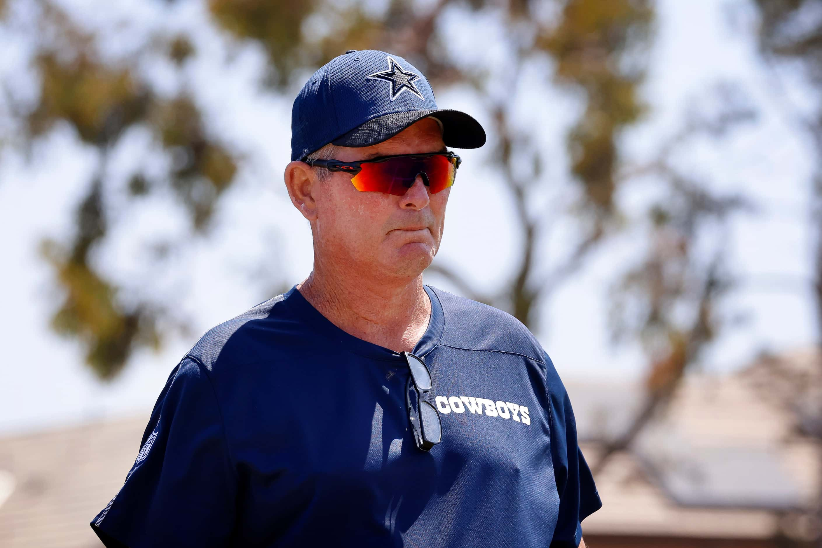 Dallas Cowboys defensive coordinator Mike Zimmer walks the sideline during 7-on-7 plays at...