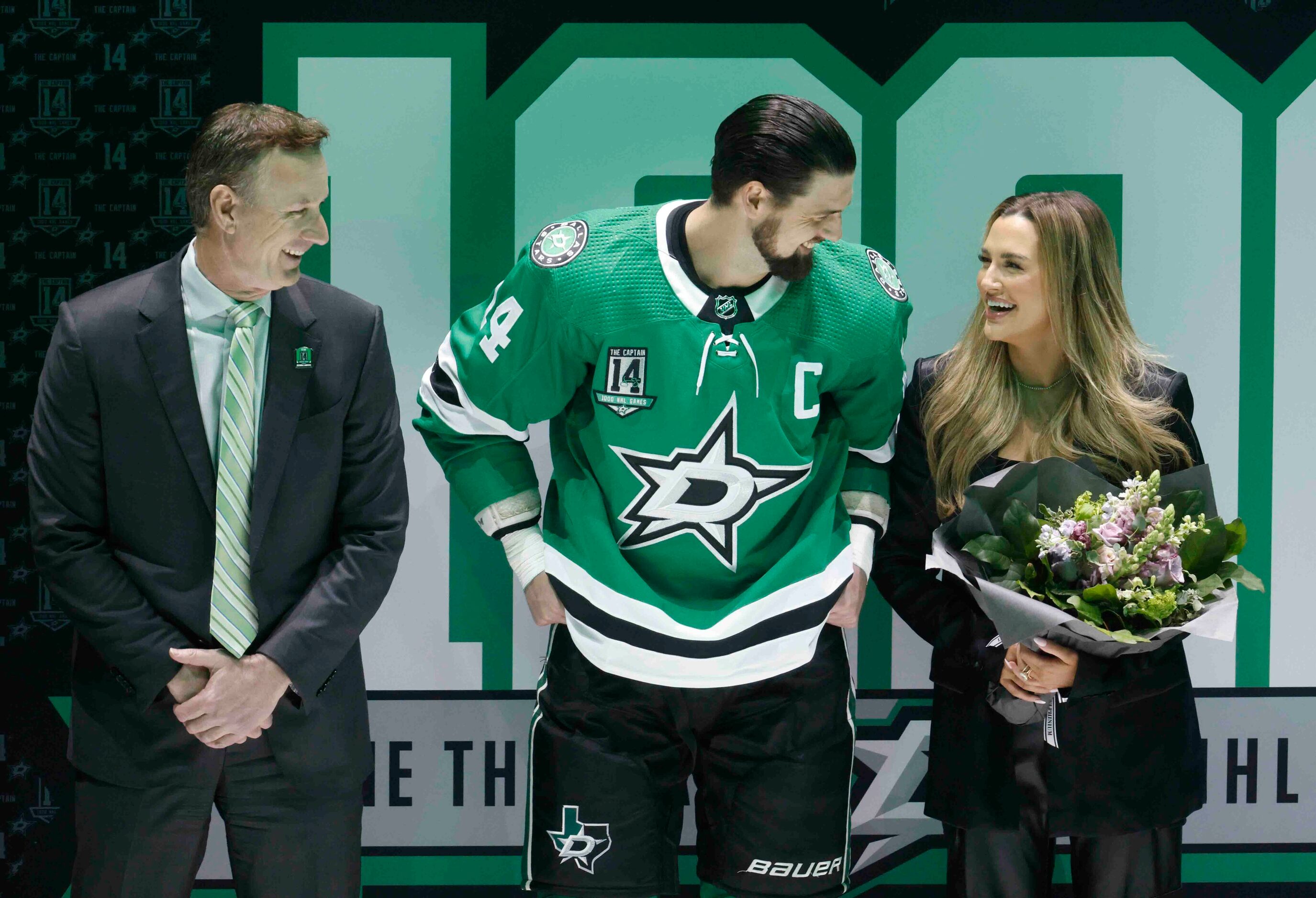 Dallas Stars President Brad Alberts (left), left wing Jamie Benn (center) and his fiancee,...