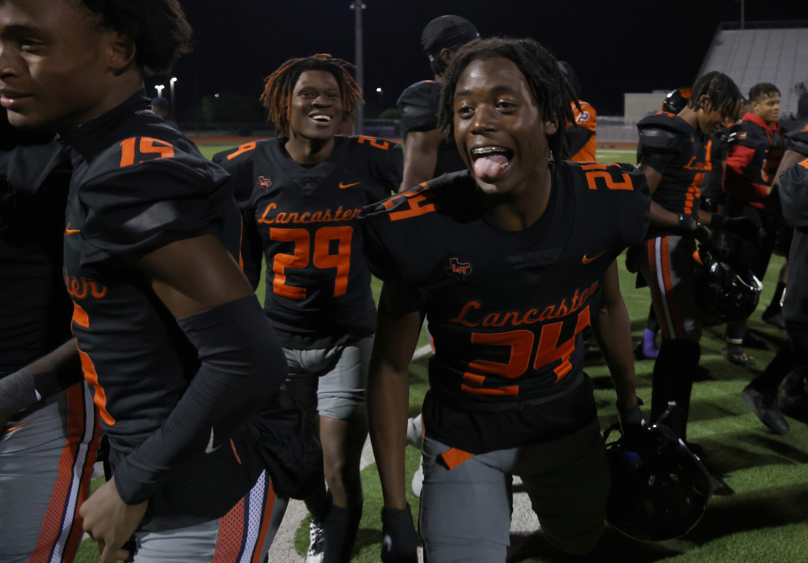 Lancaster defensive back Victor Lincoln (24), center, celebrates with teammates after...