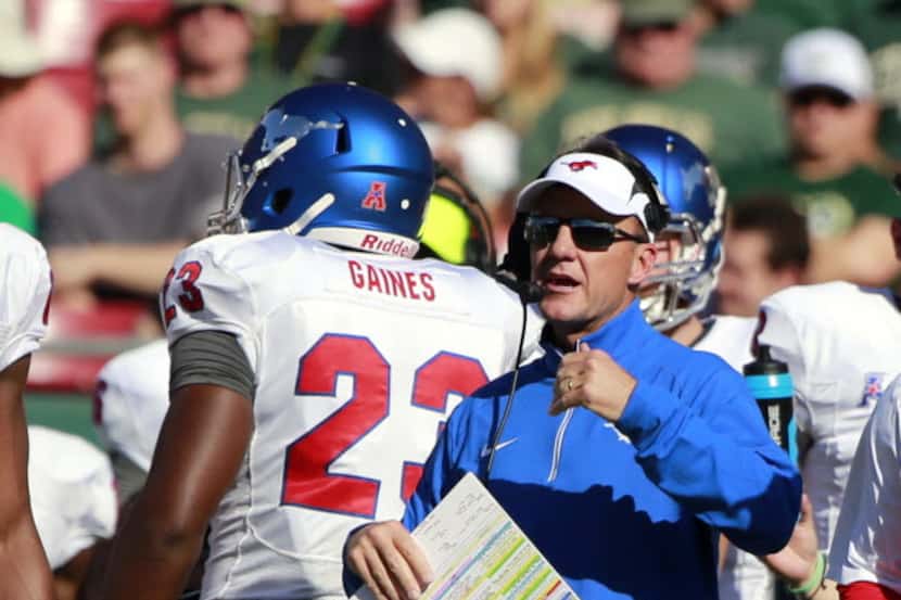 Oct 24, 2015; Tampa, FL, USA;  Southern Methodist Mustangs head coach Chad Morris calls the...
