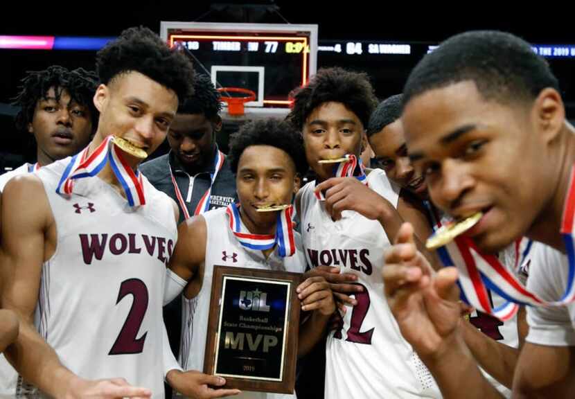 Mansfield players mug for camera. UIL boys basketball 5A State Final between Mansfield...