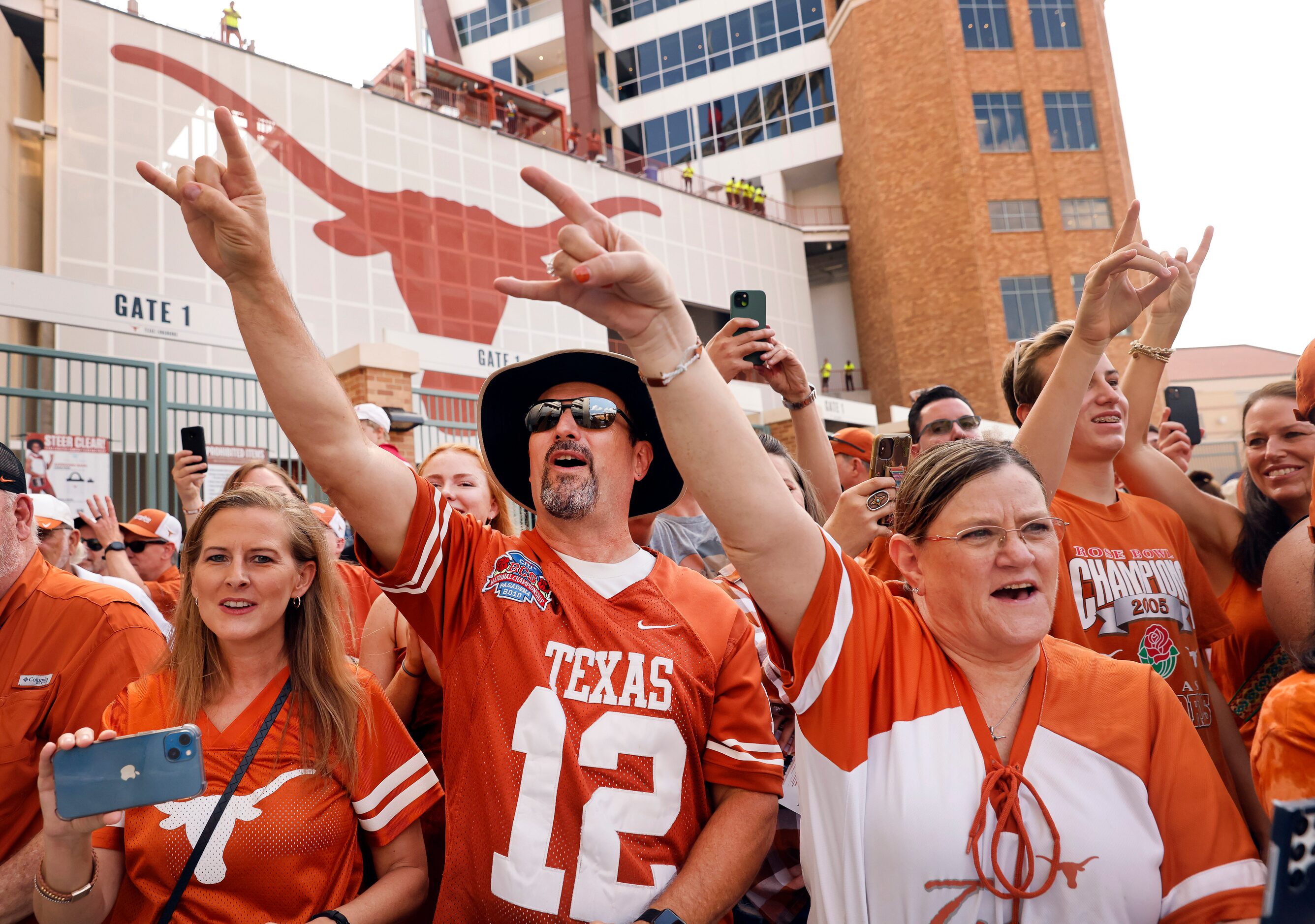 Texas Longhorns fans cheer as the team arrives for their game against the Alabama Crimson...