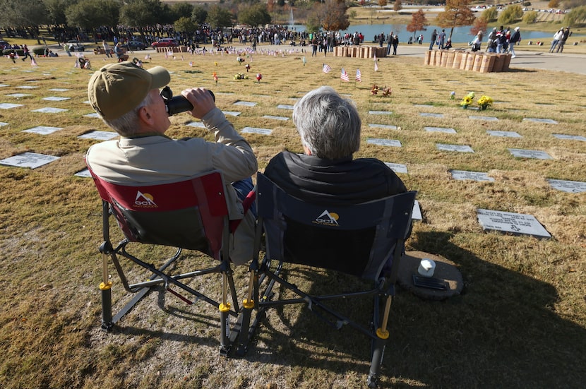 Jim and Allison Summers, of Dallas, take in the pleasant weather as they park their lawn...